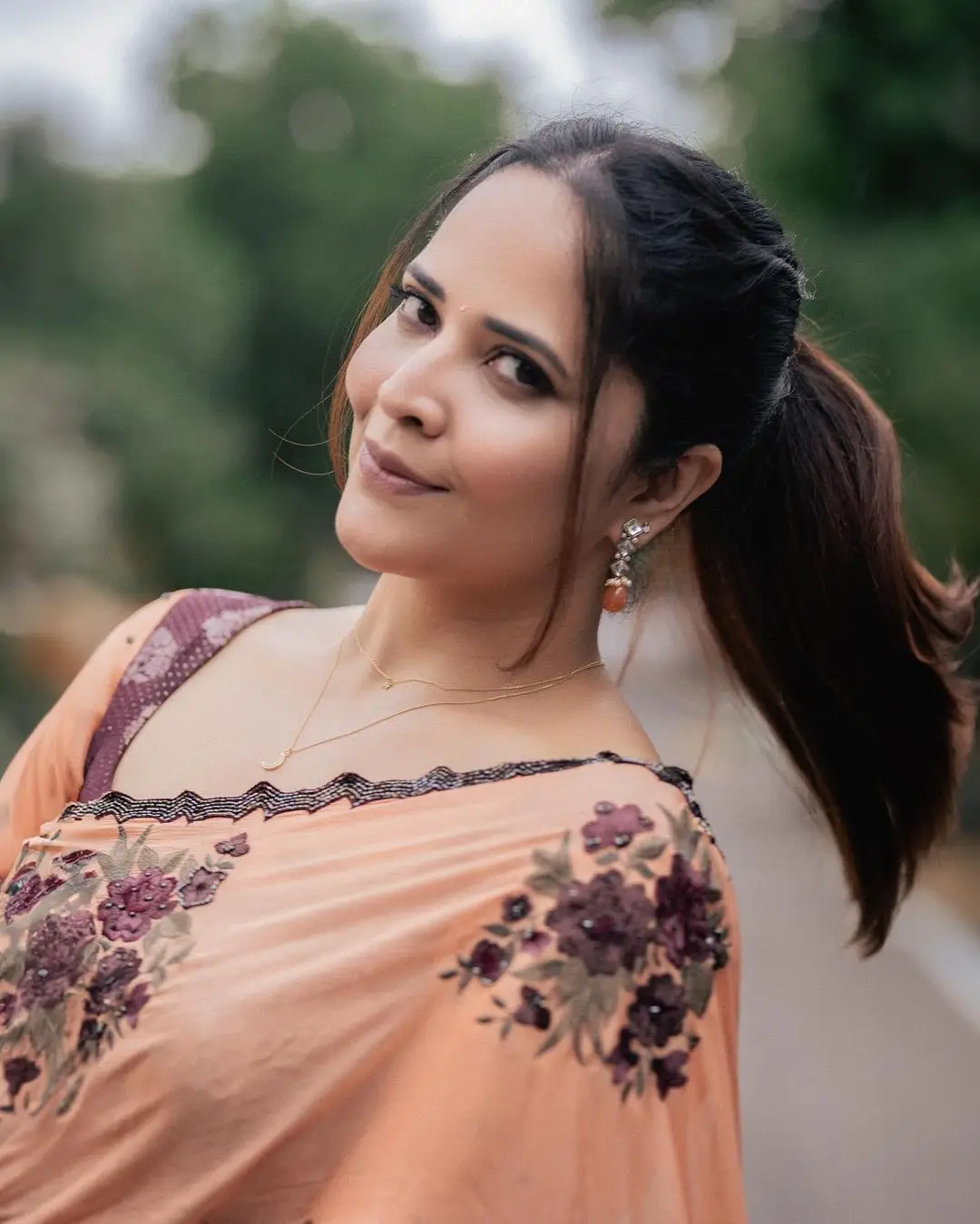 Anasuya Bharadwaj Wearing Beautiful Earrings Orange Saree Blouse